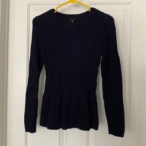 Sweater with cable pattern and peplum